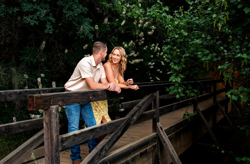 Couples photo shoot by Kendra Evans Photography on a bridge at Buttermilk Trail on the Yuba River