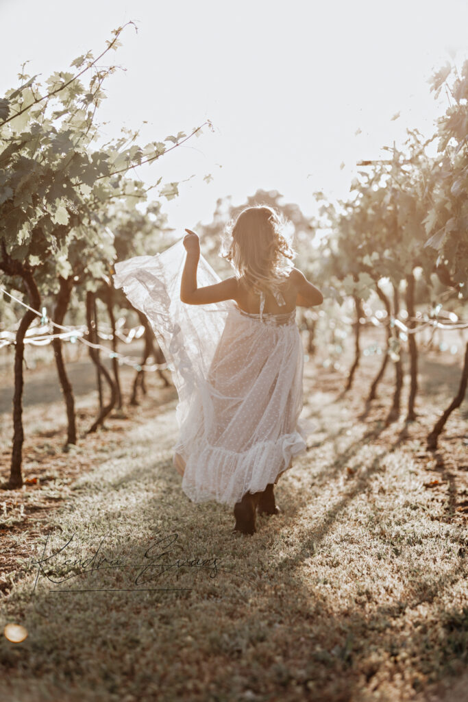 little girl skipping through the vineyard Rough and ready vineyard.