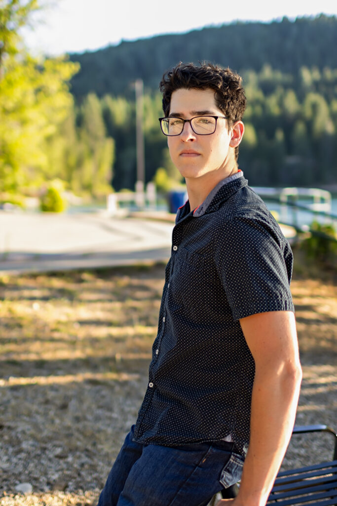 Senior boy portrait with lake background